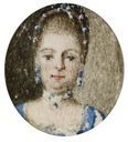 Small oval miniature, probably for a ring, representing a lady with jewels and a blue dress.