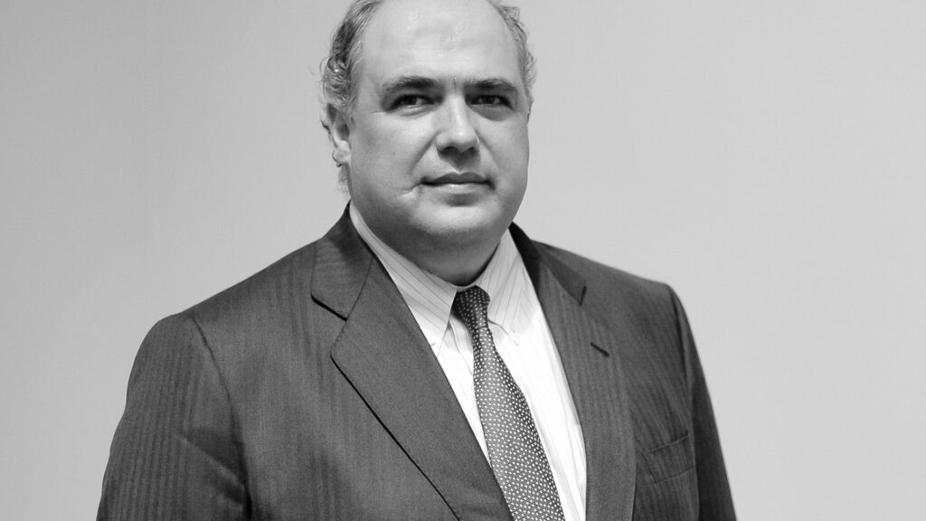 Black and white photo of a man in a suit