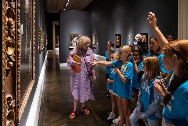 Meadows Museum docent giving a tour to schoolchildren