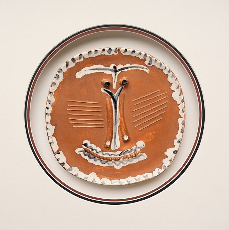 Pablo Picasso (1881–1973), Face with Pinched Nose (Visage au nez pincé), 1959. Engobe and glaze on earthenware, 10 x 10 x 1 in. (25.4 x 25.4 x 2.5 cm). Meadows Museum, SMU, Dallas. Gift of The Robert (’83) and Tina Tonti Family, MM.2025.23
